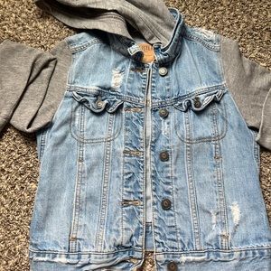 Super cool jean jacket with rips and a hoodie